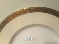 A Set of Eight Minton H3706 Gold Encrusted Dinner Plates