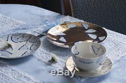 Porcelain set a golden dinner plate, a white starter plate, a tea pair